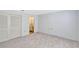 Bedroom features neutral carpet, closet and ensuite bathroom at 1236 Villa Ln # 143, Apopka, FL 32712