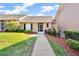 Charming single-story home with manicured lawn and inviting walkway at 1236 Villa Ln # 143, Apopka, FL 32712