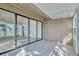 Enclosed sunroom with sliding doors leading to the living area, offering lots of natural light at 1236 Villa Ln # 143, Apopka, FL 32712