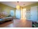 bedroom with wood floors, dinosaur-themed decor, white closet doors and hanging pendant light at 13301 Mcmillan Dr, Orlando, FL 32827