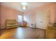 Bedroom featuring a crib, rocking chair, closet, and light pink walls and hard surface floors at 13301 Mcmillan Dr, Orlando, FL 32827