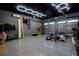A spacious garage with an epoxy floor, custom lighting, and lots of storage space at 13301 Mcmillan Dr, Orlando, FL 32827