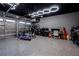 An organized garage with an epoxy floor, and custom lighting at 13301 Mcmillan Dr, Orlando, FL 32827