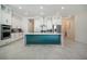 Contemporary kitchen with white cabinetry, stainless steel appliances, and a green-colored island with white countertop at 13301 Mcmillan Dr, Orlando, FL 32827