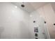 Close-up view of the modern shower featuring a white subway tile surround, glass enclosure, and a rain shower head at 13301 Mcmillan Dr, Orlando, FL 32827