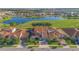 A beautiful home with a well manicured lawn overlooks a scenic lake and golf course, offering tranquil scenery at 13307 Alderley Dr, Orlando, FL 32832