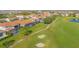 Beautiful aerial view of homes overlooking the lush green golf course and pristine landscaping in this lovely community at 13307 Alderley Dr, Orlando, FL 32832