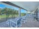 Spacious covered balcony featuring comfortable seating and exercise equipment, perfect for relaxation and fitness with scenic views at 13307 Alderley Dr, Orlando, FL 32832