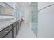 Bathroom featuring granite counters, modern fixtures, and a glass walk-in shower adjacent to the vanity at 13307 Alderley Dr, Orlando, FL 32832