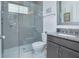 Bathroom displaying a glass enclosed walk-in shower, granite counters, and modern fixtures at 13307 Alderley Dr, Orlando, FL 32832