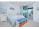 Comfortable bedroom with waterfront balcony access, providing serene views and a relaxing ambiance at 13307 Alderley Dr, Orlando, FL 32832