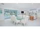 Open concept dining room with easy access to the pool, living room, and outdoor living space at 13307 Alderley Dr, Orlando, FL 32832