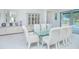 Bright dining room with glass table, seating for eight, and views of the pool at 13307 Alderley Dr, Orlando, FL 32832