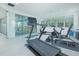 Bright exercise room with state-of-the-art equipment and large windows providing scenic views at 13307 Alderley Dr, Orlando, FL 32832
