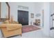 Bright foyer with double doors, stylish decor, and a comfortable couch at 13307 Alderley Dr, Orlando, FL 32832