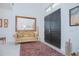 Elegant foyer with double doors, a large mirror, and a welcoming couch at 13307 Alderley Dr, Orlando, FL 32832