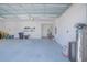 Spacious three-car garage with freshly painted white walls and a sealed epoxy floor, providing ample storage and parking at 13307 Alderley Dr, Orlando, FL 32832