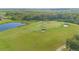 Scenic view of the golf course with sand traps, green grass, and natural surroundings, offering a tranquil landscape at 13307 Alderley Dr, Orlando, FL 32832