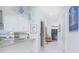 Hallway with a view of the foyer, granite counter and kitchen at 13307 Alderley Dr, Orlando, FL 32832