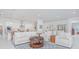 Open concept living room with modern kitchen, dining area, and comfortable seating at 13307 Alderley Dr, Orlando, FL 32832