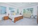 Comfortable main bedroom with great natural light, sitting area, and a neutral color palette at 13307 Alderley Dr, Orlando, FL 32832