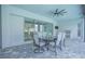 Covered patio with ample seating and outdoor kitchen overlooking beautiful scenery, perfect for dining and relaxation at 13307 Alderley Dr, Orlando, FL 32832