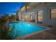 Beautiful pool and patio area with outdoor dining, perfect for relaxing and entertaining guests in style at 13307 Alderley Dr, Orlando, FL 32832