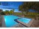 Relax in this stunning pool and spa with a tranquil view of the golf course, perfect for outdoor enjoyment at 13307 Alderley Dr, Orlando, FL 32832