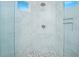Spacious shower with grey tiles, stone floor, and rain shower head, offering a luxurious experience at 13307 Alderley Dr, Orlando, FL 32832