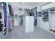 Spacious walk-in closet with custom built-in shelving and drawers for optimal storage at 13307 Alderley Dr, Orlando, FL 32832