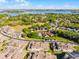 Aerial view of townhomes with view of the lake in the distance at 13326 Fountainbleau Dr, Clermont, FL 34711