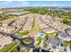 Aerial view of a neighborhood featuring a community pool and clubhouse at 13326 Fountainbleau Dr, Clermont, FL 34711