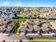 Aerial view of townhomes with manicured lawns and mature landscaping at 13326 Fountainbleau Dr, Clermont, FL 34711