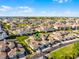 Aerial view of townhomes, manicured lawns, and mature landscaping at 13326 Fountainbleau Dr, Clermont, FL 34711