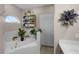 Bathroom includes a soaking tub, separate shower, and decorative shelving and accents at 13326 Fountainbleau Dr, Clermont, FL 34711