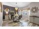 Charming dining room featuring a glass table, designer lighting, and contemporary decorative accents at 13326 Fountainbleau Dr, Clermont, FL 34711