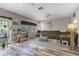 Spacious living room with wood-look flooring, neutral colors and lots of natural light at 13326 Fountainbleau Dr, Clermont, FL 34711