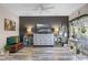 Stylish living room with wood-look flooring, neutral colors and a mounted television at 13326 Fountainbleau Dr, Clermont, FL 34711
