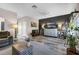 Stylish living room with wood-look flooring, neutral colors and a mounted television at 13326 Fountainbleau Dr, Clermont, FL 34711