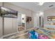 Spacious main bedroom features a ceiling fan, TV and an en suite bathroom for convenience at 13326 Fountainbleau Dr, Clermont, FL 34711