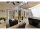 Cozy covered patio with hot tub, ceiling fan, comfortable seating, and decorative lighting at 13326 Fountainbleau Dr, Clermont, FL 34711