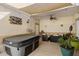 Relaxing covered patio with hot tub, comfortable seating, plants and decorative lighting at 13326 Fountainbleau Dr, Clermont, FL 34711