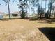 Large backyard surrounded by mature trees offering privacy and shade at 13405 Sw 86Th Ave, Ocala, FL 34473