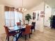 Cozy dining room with wood table, decorative chandelier, and modern wood-look floors at 13405 Sw 86Th Ave, Ocala, FL 34473