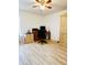 Well-lit home office with a desk, computer, chair, and ample storage space at 13405 Sw 86Th Ave, Ocala, FL 34473