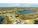 An aerial view of the property highlighting the lake, nearby amenities, and community landscape at 15060 Brodie Ln, Winter Garden, FL 34787