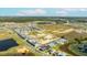 An aerial view shows proximity to commercial areas and community layout with water features at 15060 Brodie Ln, Winter Garden, FL 34787