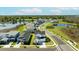Stunning aerial view of neighborhood homes, ponds, and lush green landscapes at 15060 Brodie Ln, Winter Garden, FL 34787