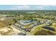 An aerial view displays the home's location in the community, situated near a serene pond at 15060 Brodie Ln, Winter Garden, FL 34787