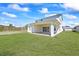 Large backyard with covered patio, ideal for relaxation and outdoor gatherings, in a tranquil setting at 15060 Brodie Ln, Winter Garden, FL 34787